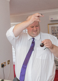 Groom checks out the pocketwatch from his bride to be at Ye Olde Plough House