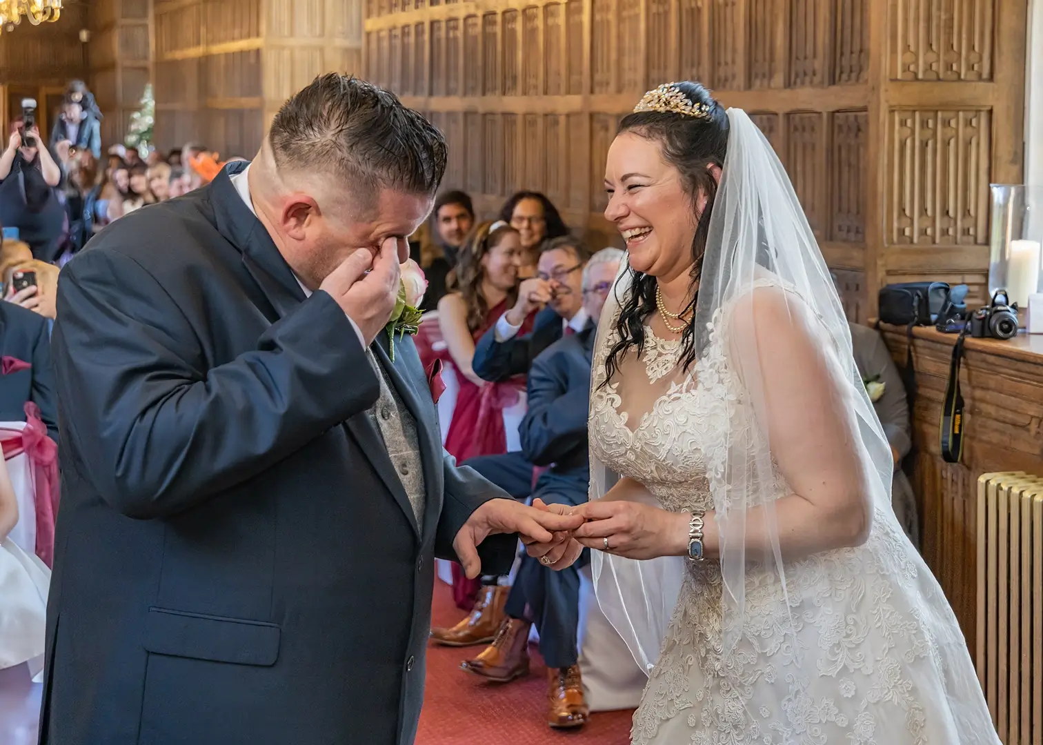 Couple giggling during their wedding ceremony at Gosfield Hall