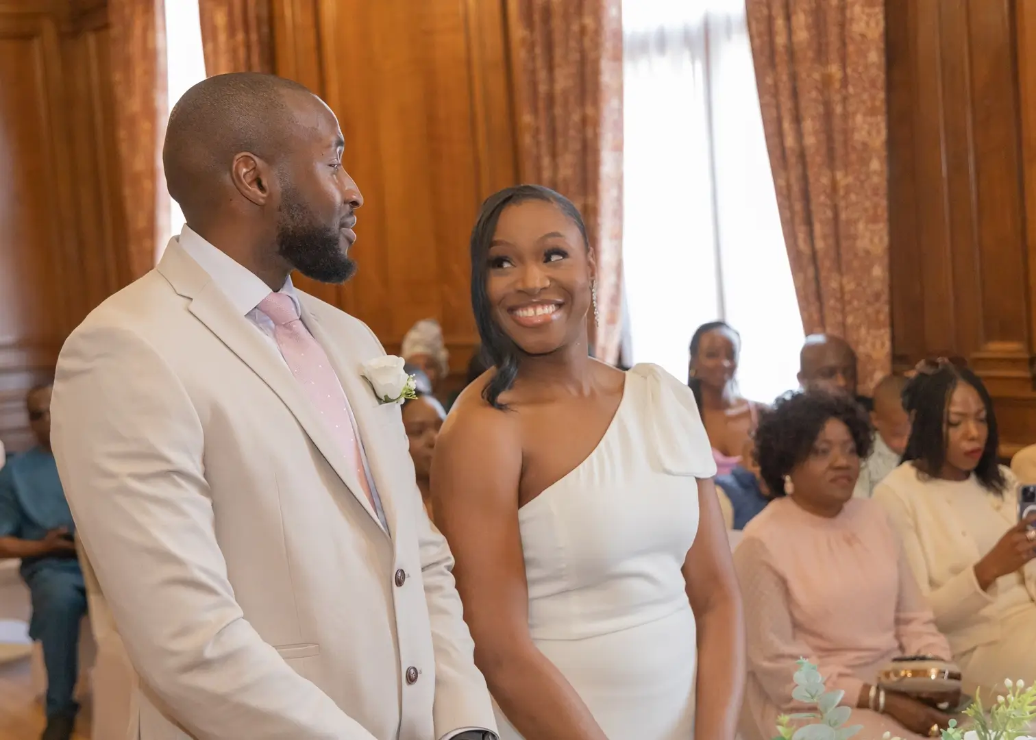 Bride smiles at her groom during the wedding ceremony at Braintree Town Hall