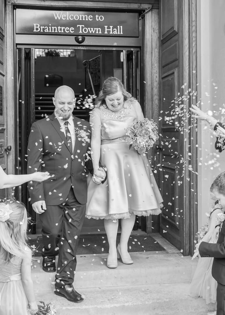 Bride and groom with confetti in black and white