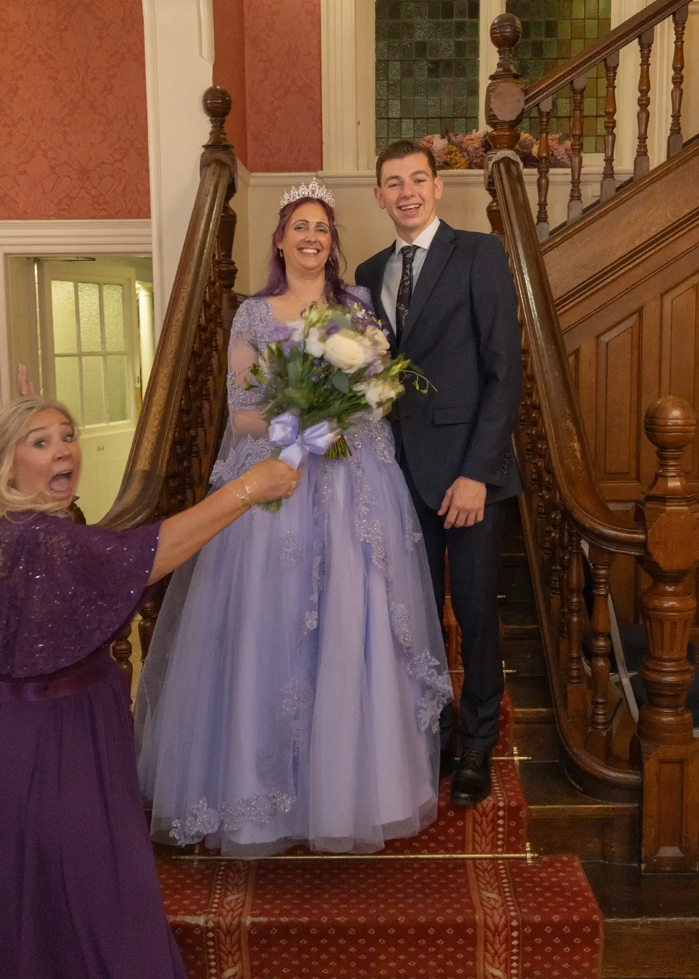 Bridesmaid photobombs a staircase portrait at Langtons House