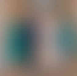 Bride in soft mocha dress with bridal party in green at Colchester Town Hall