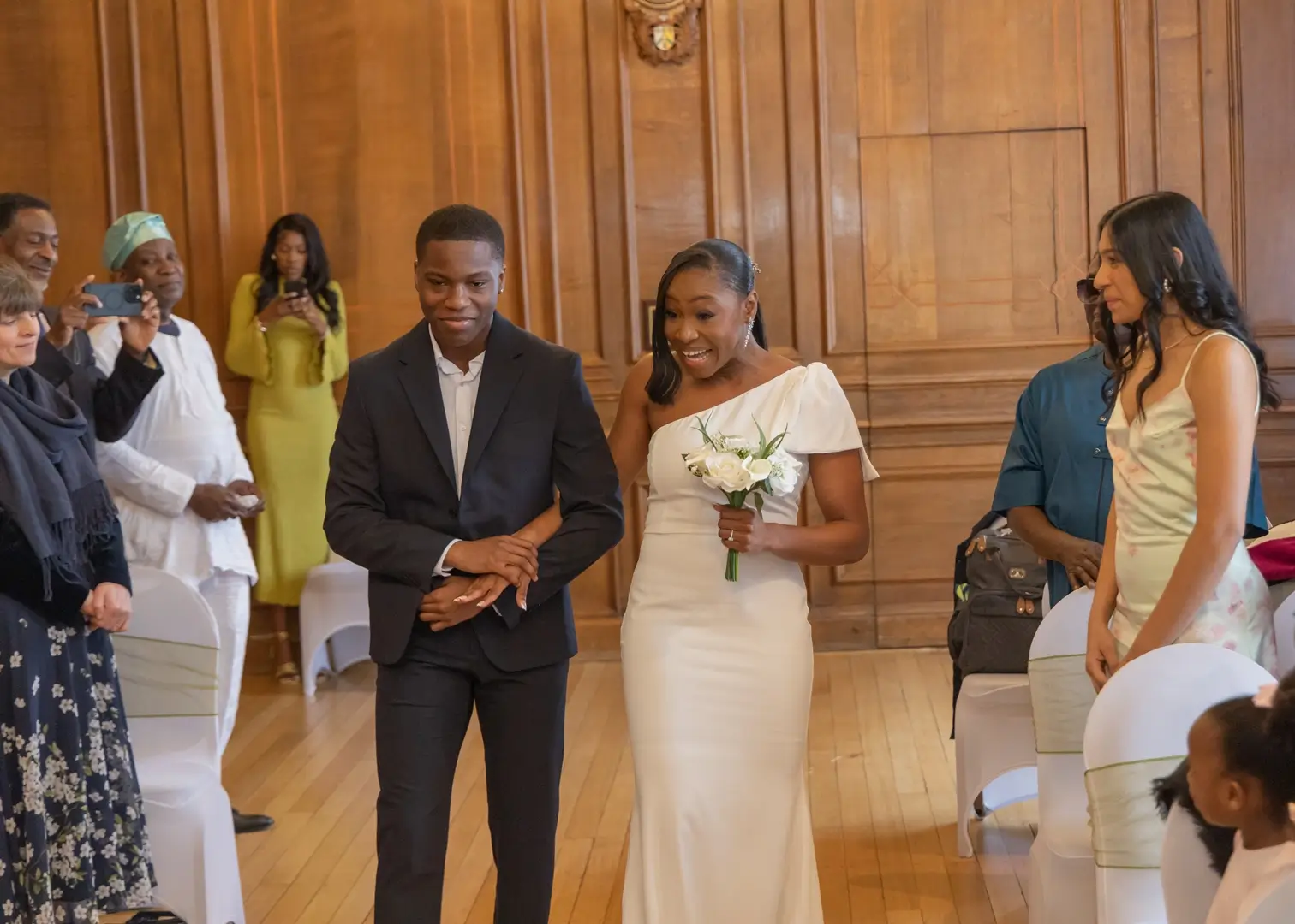 Brides entrance with her brother at Braintree Town Hall