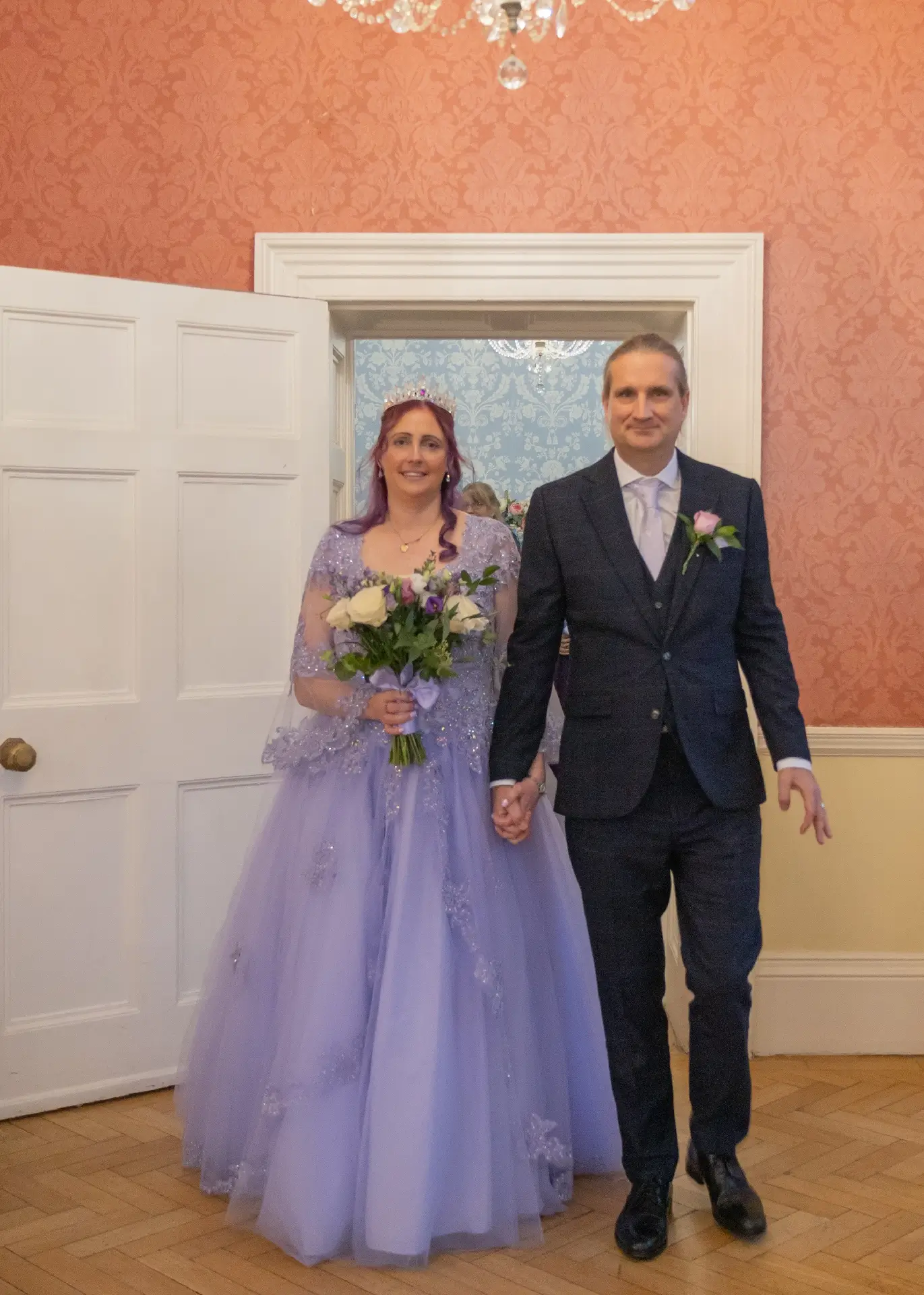 Bride and groom enter the main entrance after their ceremony at Langtons House