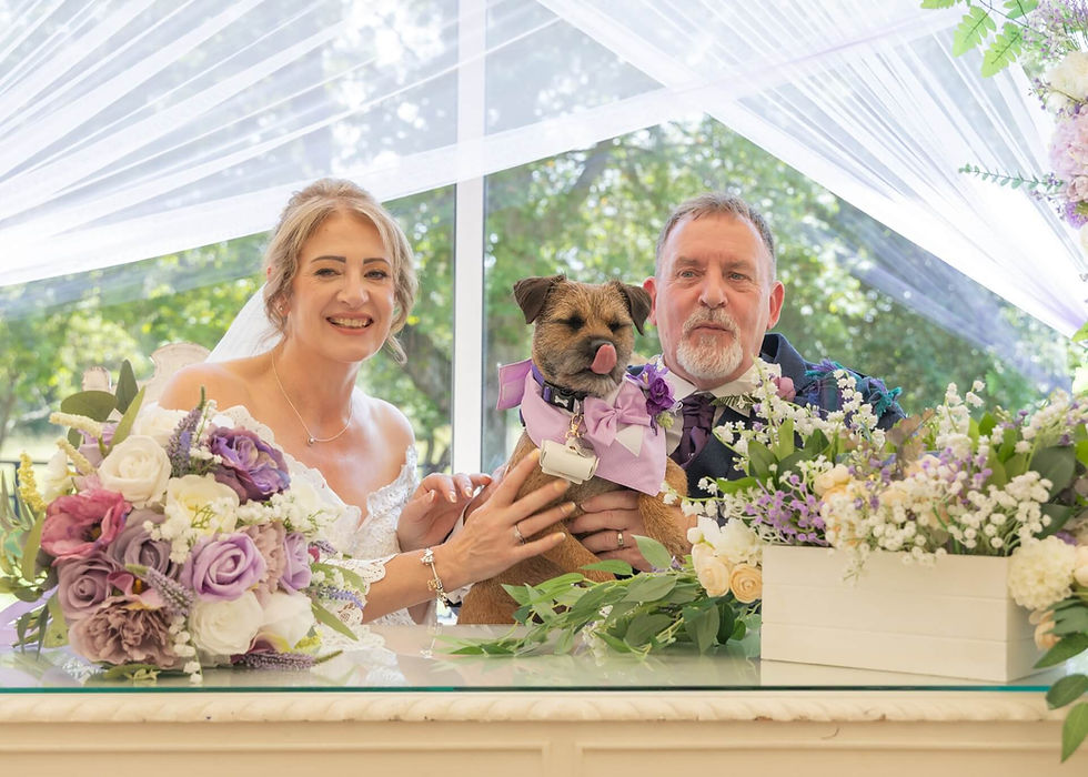Doggie ring bearer with the bride and groom at The Fennes