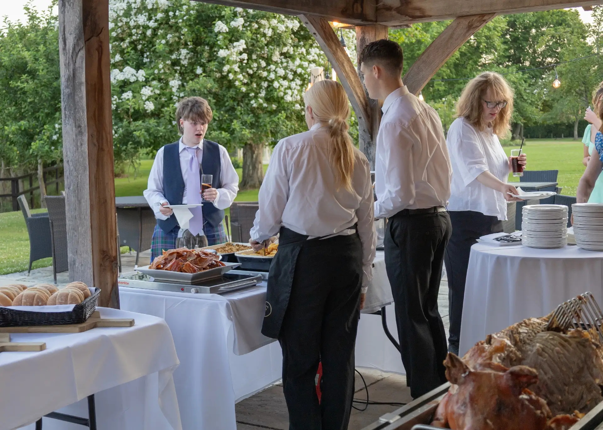 Hog roast at an evening wedding reception at The Fennes