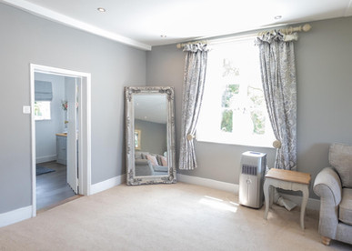 Bridal preparation room showing entrance to bathroom at Newland Hall Chelmsford