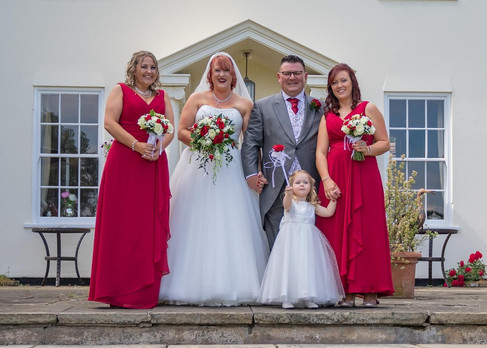 Bridal party on the steps at Sturmer Hall
