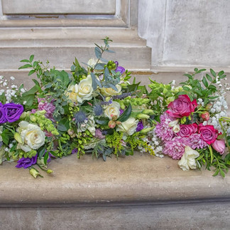 Pink, purple and cream bouquets with greenery