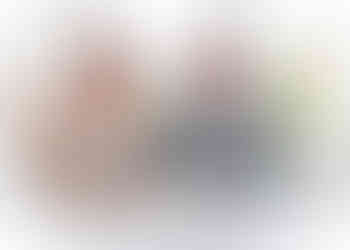 Bride and groom sit at the table to sign the register with the sunlit gardens of Wivenhoe House Hotel behind them