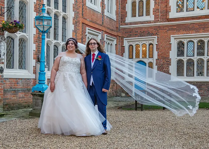 Bride and groom in the inner courtyard at Gosfield Hall