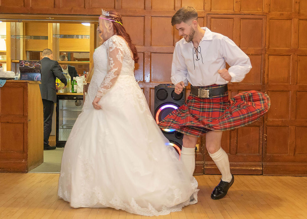 Langtons House wedding photo of groom in kilt dancing with his wife