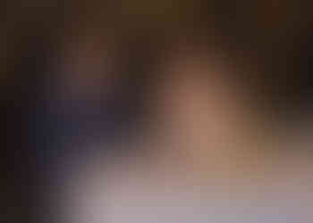 Bride and groom enjoying their sweetheart table by candlelight