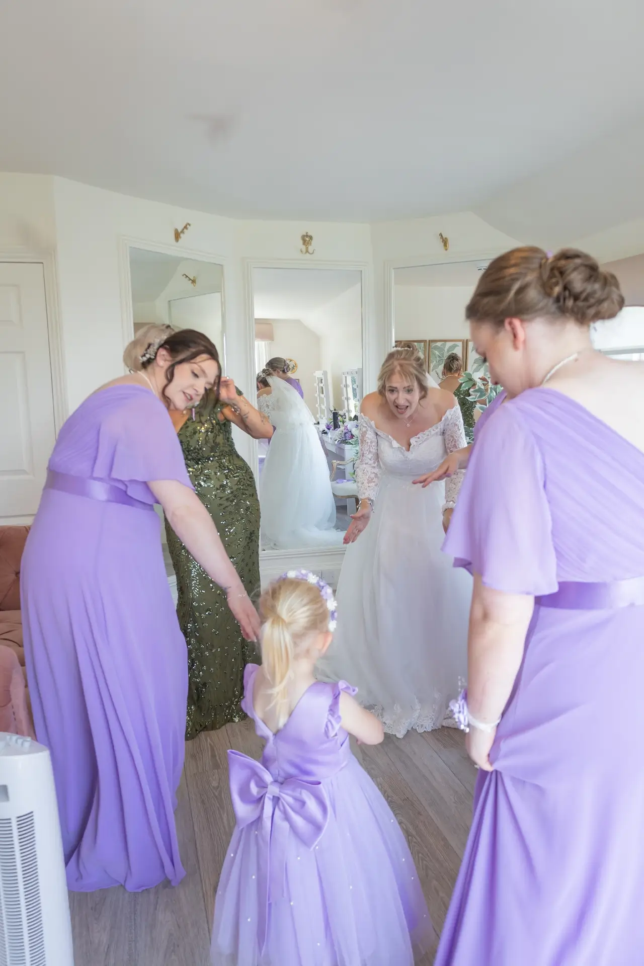 Bridal party dancing and having fun during preparations at The Fennes
