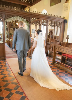 Black Notley church wedding photo of bride and groom walking down the aisle at the end of the ceremony