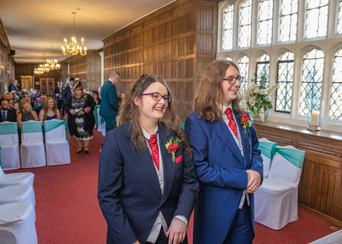 Groom and best woman wait for the brides arrival in the Queens Gallery at Gosfield Hall