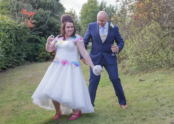 Wedding ouple showing off their moves and having fun in the grounds at Holiday Inn, Colchester