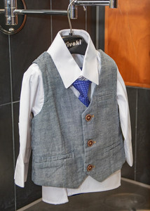 Young ushers outfit hangs ready and waiting