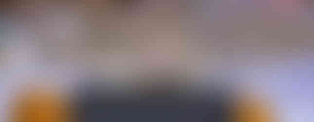 B;ack referees tabbard placed over the back of a wooden chair