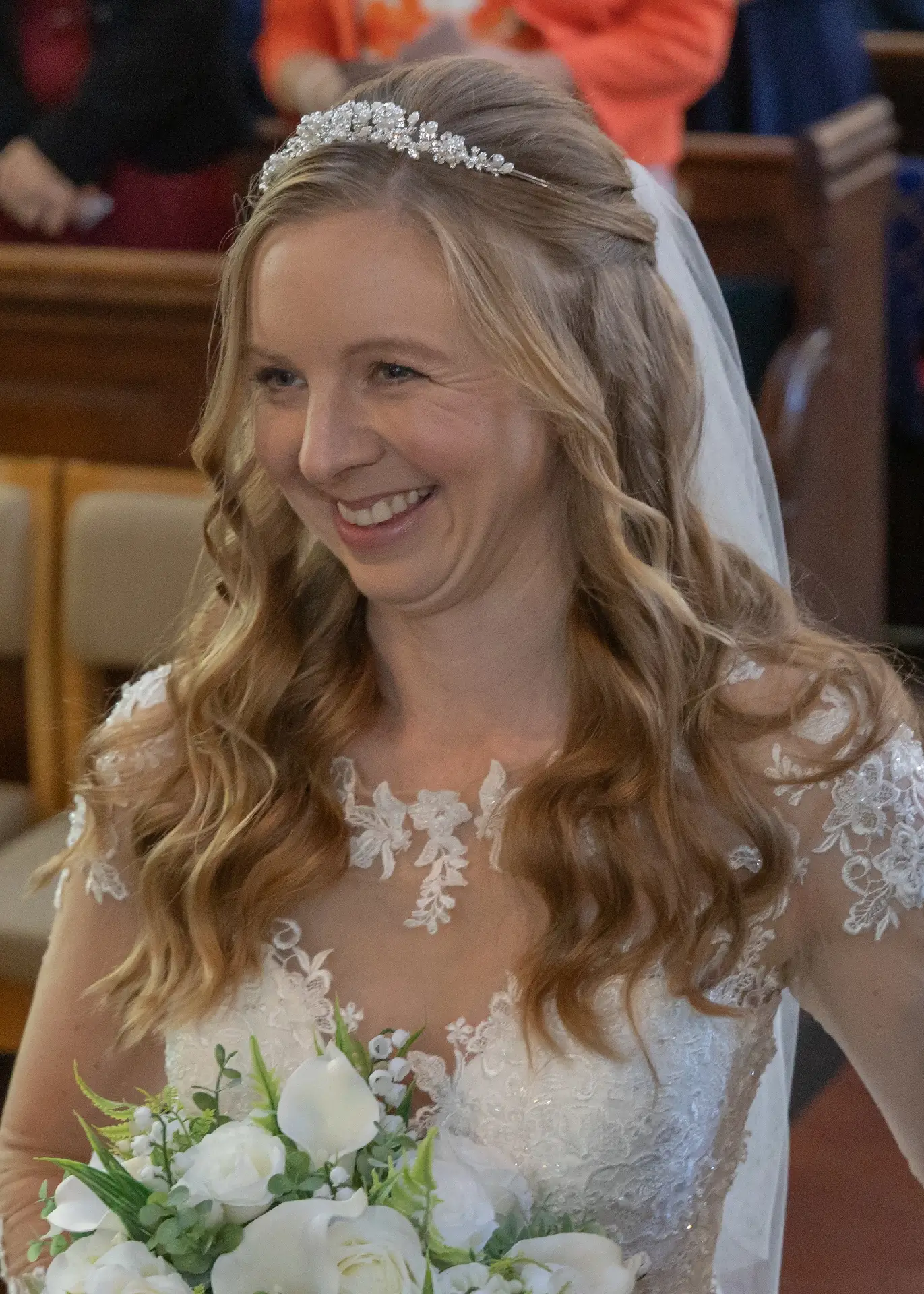 Bride smiles happily at her groom at St Marys church in Bocking, Braintree