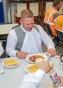 Groom enjoys a hearty builders breakfast before his wedding
