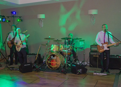 Live band playing at a wedding reception in the garden room at Wivenhoe House Hotel