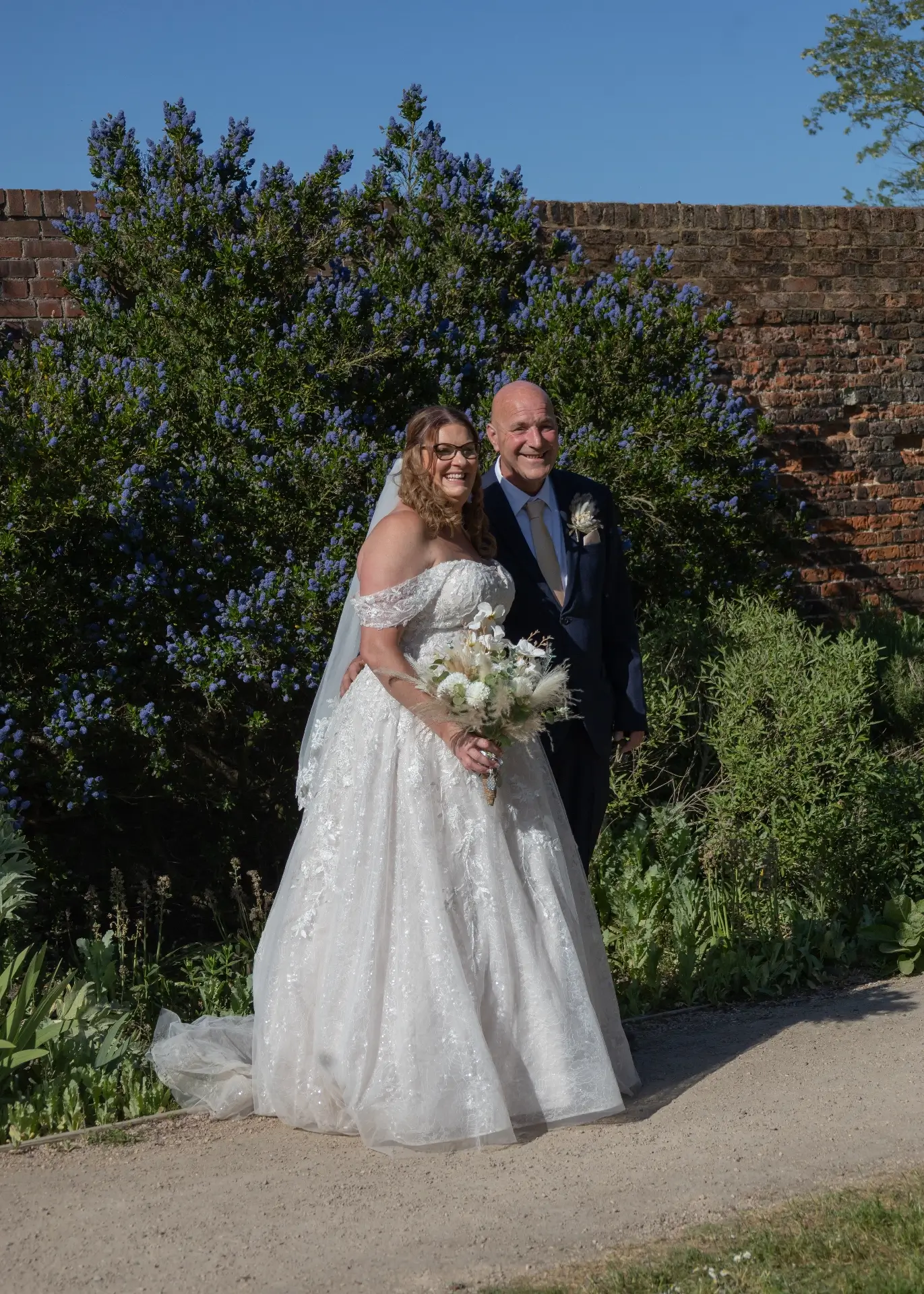 Bride and groom in the grounds at Langtons House in the sunshine
