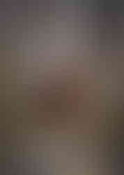 Bride and groom in a mirror in the bridal suite at a pre-wedding visit to Prested Hall