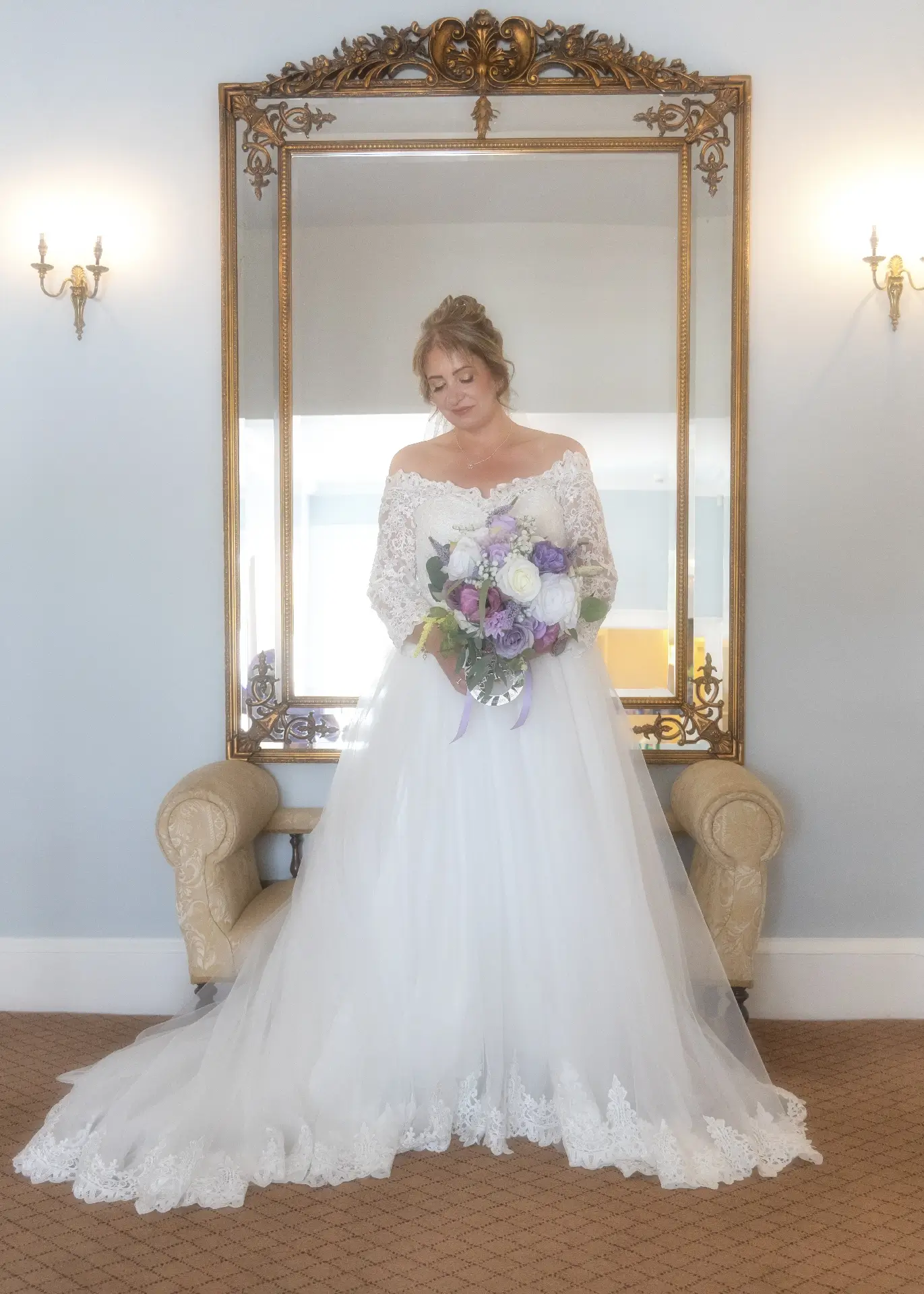 Bride at the top of the stairs at The Fennes