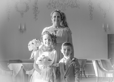 Bridesmaids and page boy waiting to enter the drawing room at Wivenhoe House Hotel