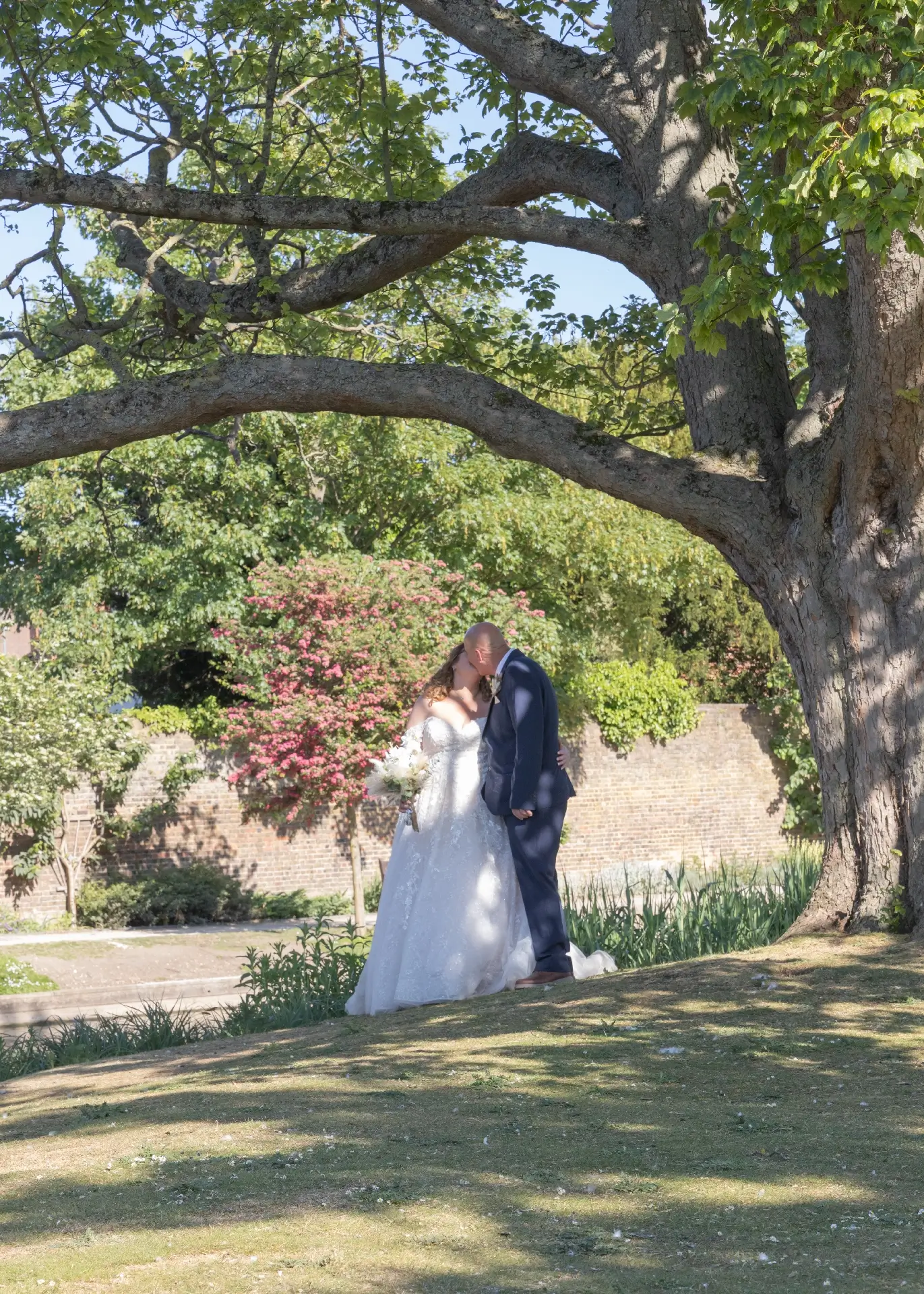 Bride and groom enjoy the sunshine at Langtons House