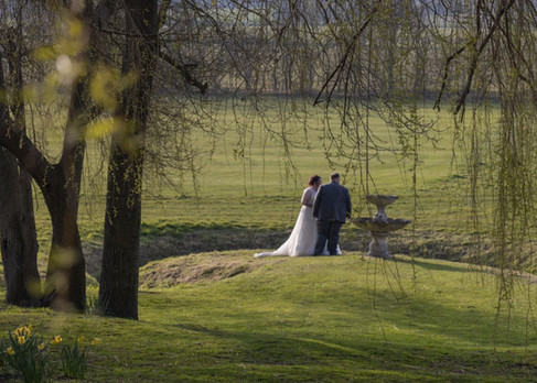 Bride and groom share a private moment in the grounds at Forrester Park Golf Club