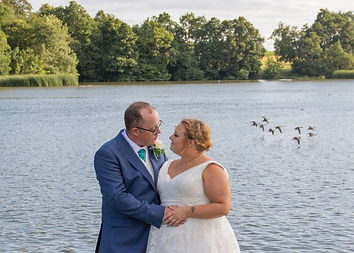 Bride and groom by the lake The Apple Tree Gosfield