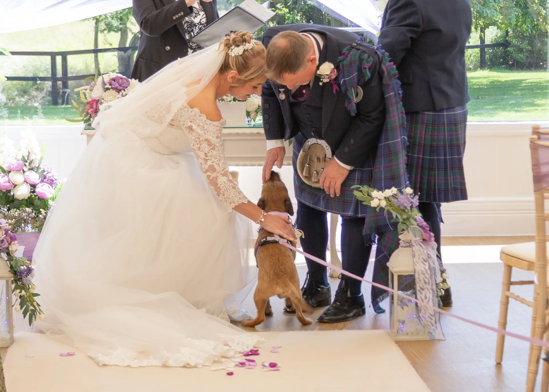 Bowie the dog delivers the wedding rings at The Fennes