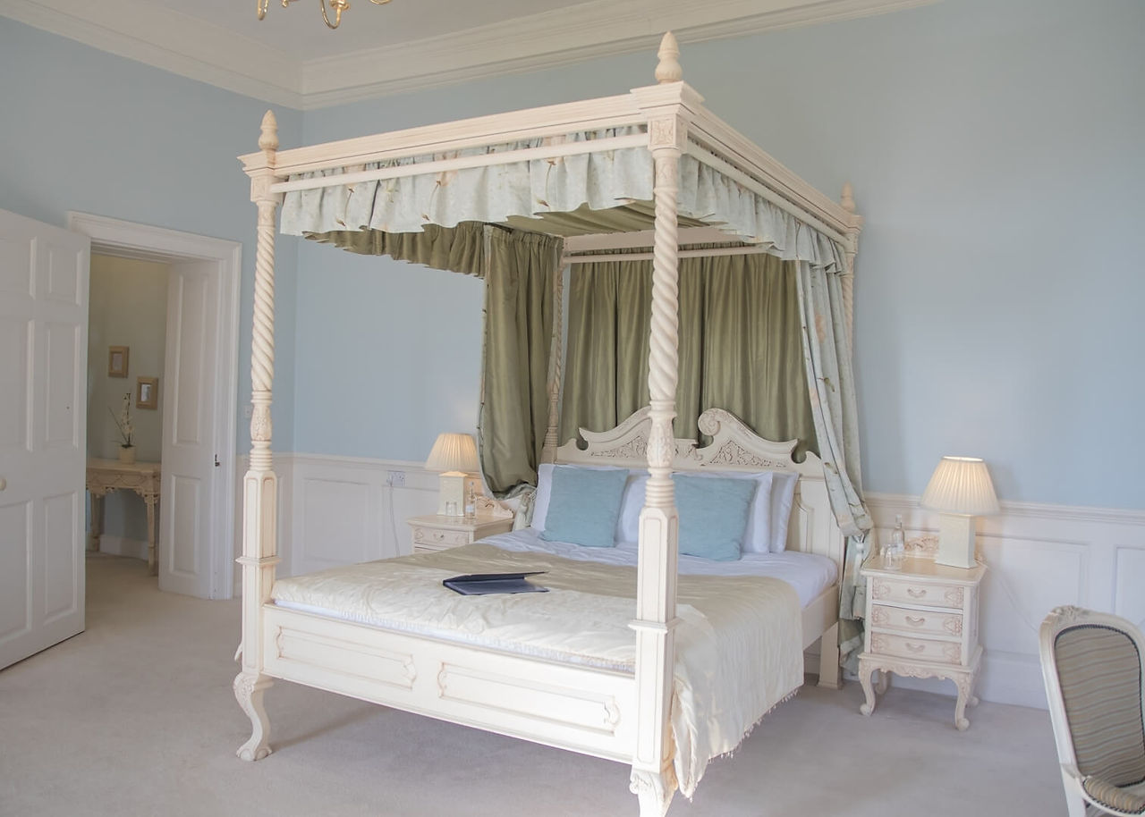 Four poster bed in one of the guest bedrooms at Gosfield Hall