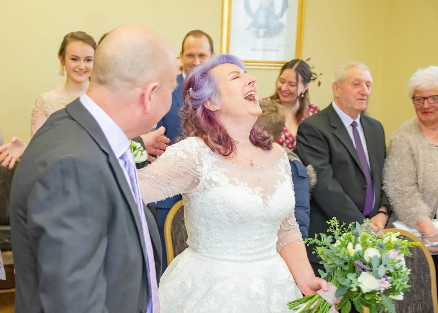 Bride laug at grooms reaction to her entrance at Braintree Town Hallhs