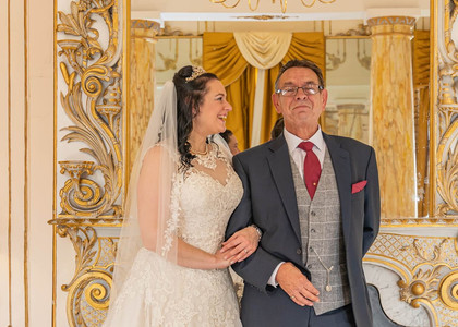 Bride and her proud father in the Rococo Suite at Gosfield Hall