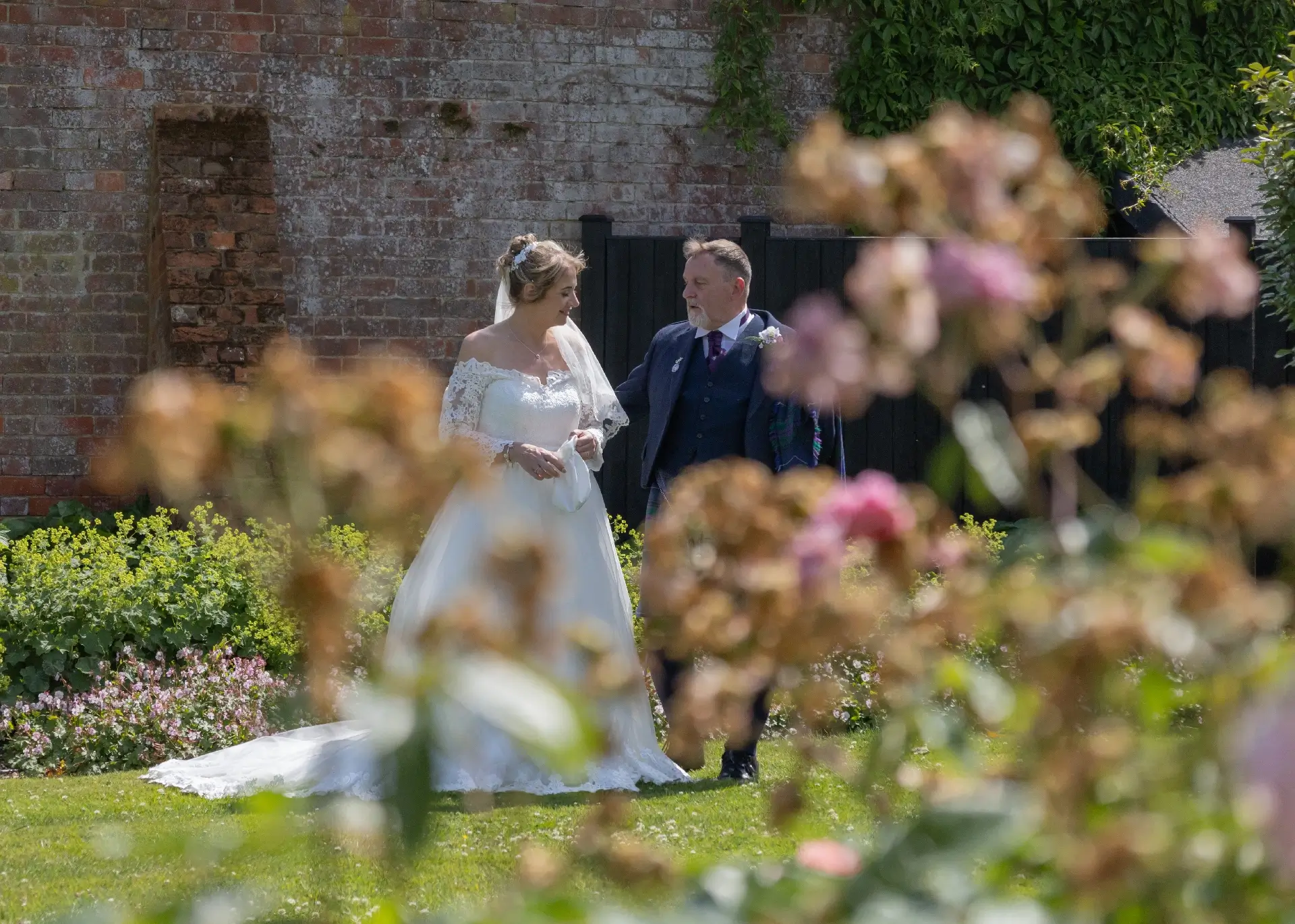 Bride and groom in the private garden at The Fennes