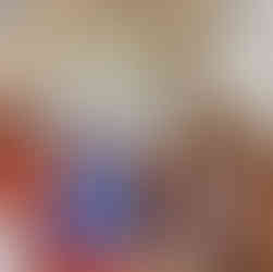 Lady in blue dress decorating church aisle and pews with white flowers