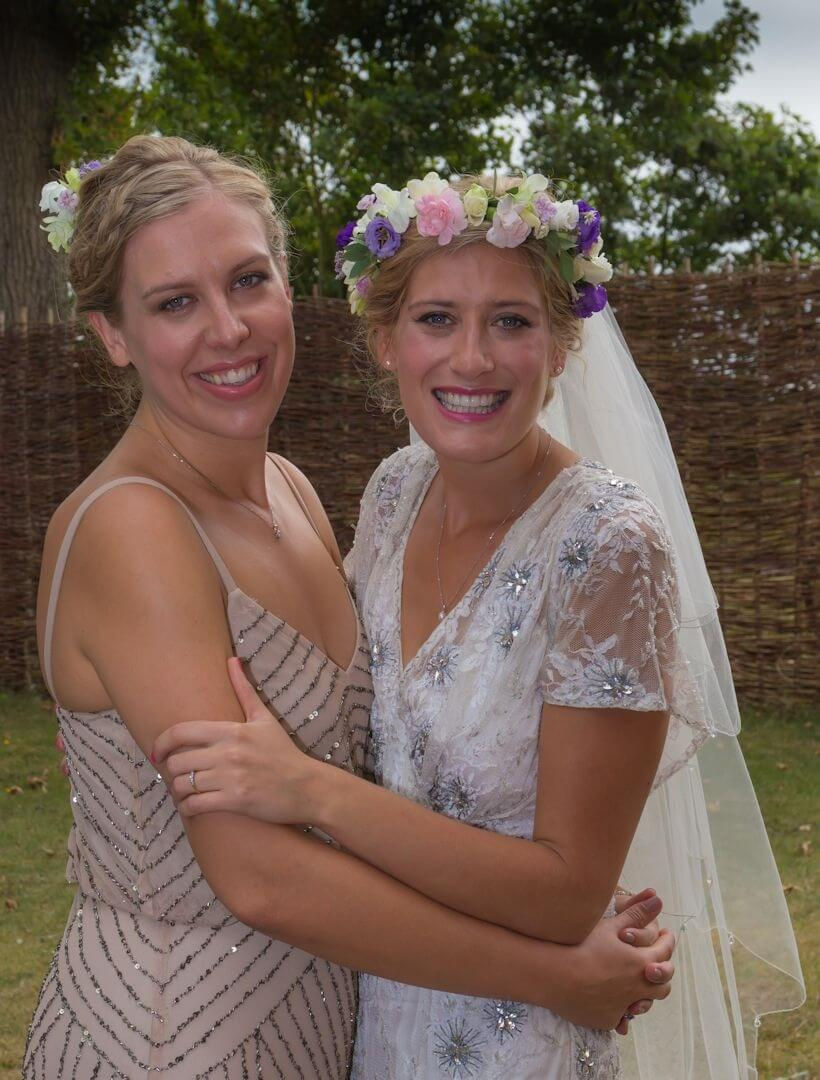 Great Lodge, Bardfield wedding photo of bride with her sister as they arrive before the wedding ceremony