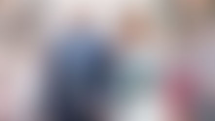 Bride laughing as she gets showered with confetti at Langtons House