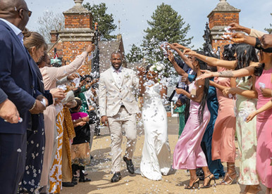 Bride and groom are showered in confetti at Braintree Town Hall