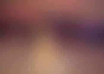 Bride and groom share their first dance on an led dancefloor at Sturmer Hall