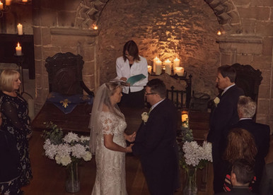 Candlelit wedding ceremony at Hedingham Castle in Essex