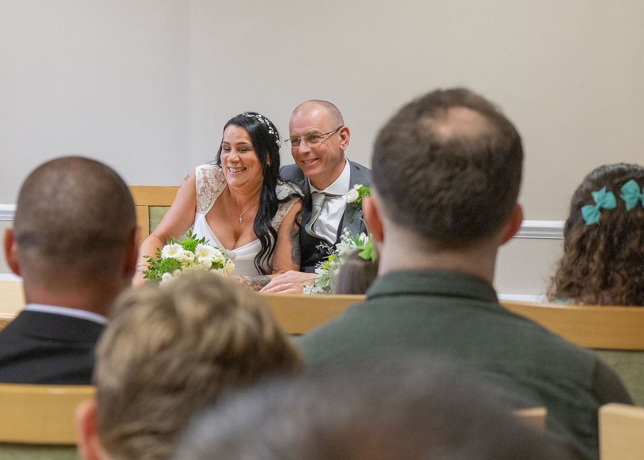 Smiling bride and groom in the community room at Colchester Town Hall