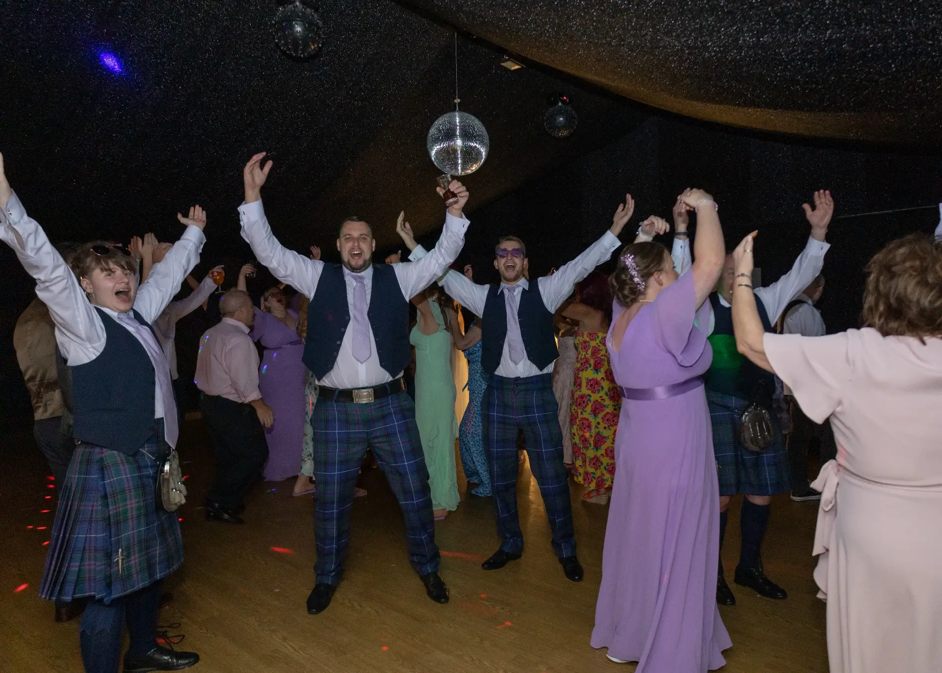 Wedidng guests on the dancefloor at The Fennes