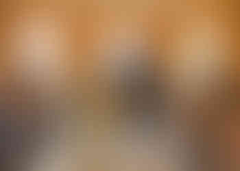 Bride in pale green leaving ceremony with groom in grey and green