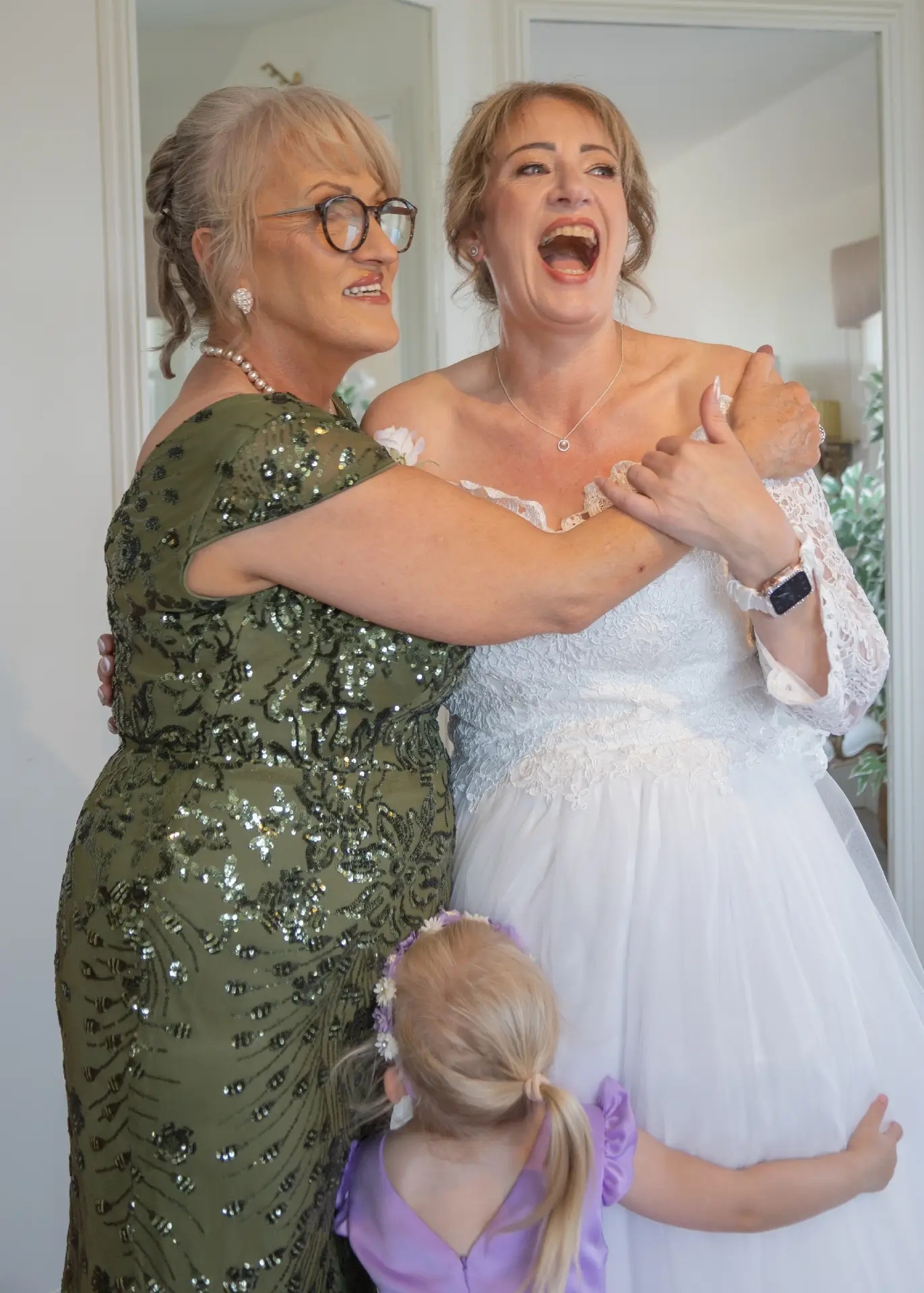 Bride laughs with her best friend at The Fennes during bridal preparations