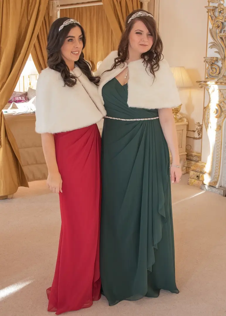 Bridesmaids in Christmas red and green dresses at Gosfield Hall