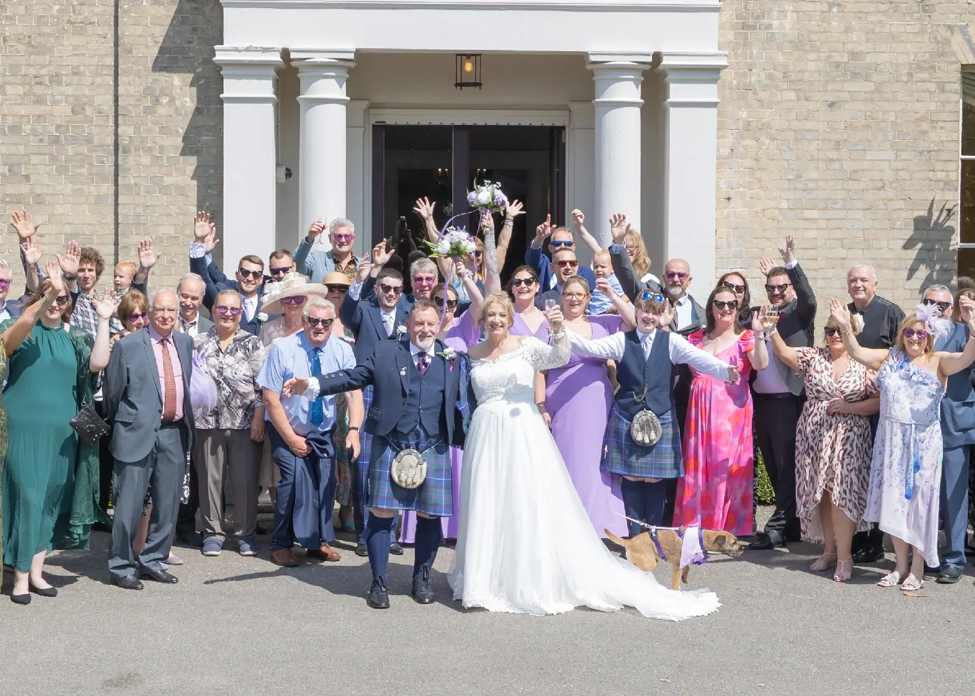 Wedidng group photo outside The Fennes front entrance